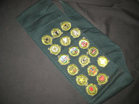 Explorer Dark Green Sash with 17 crimped edge, folded under Merit Badges