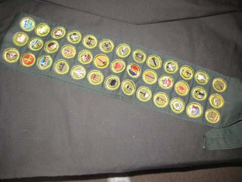 Dark Green Sash with 39 Crimped Edge Merit Badges
