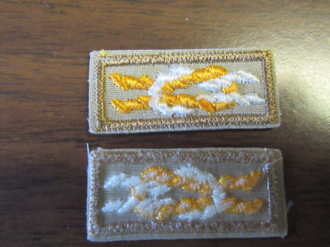 Silver Antelope Award Knot, on tan, medium brown border on back